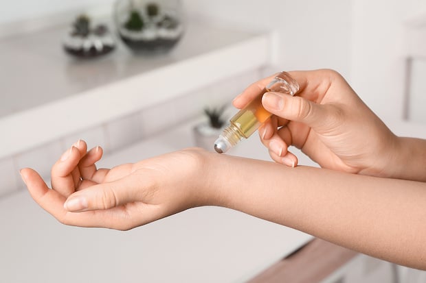 bigstock-Woman-Applying-Essential-Oil-O-304395382 copy